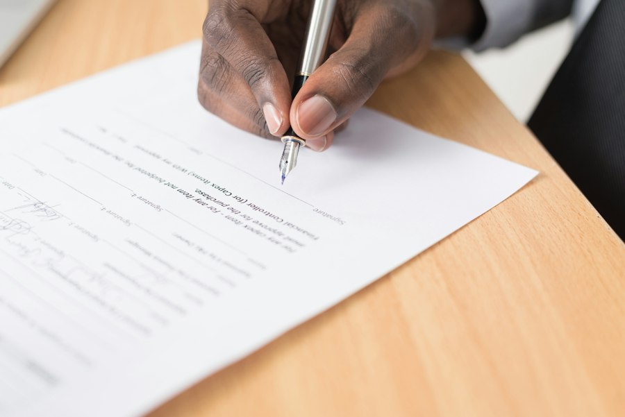 Signing a law firm sale agreement across a desk