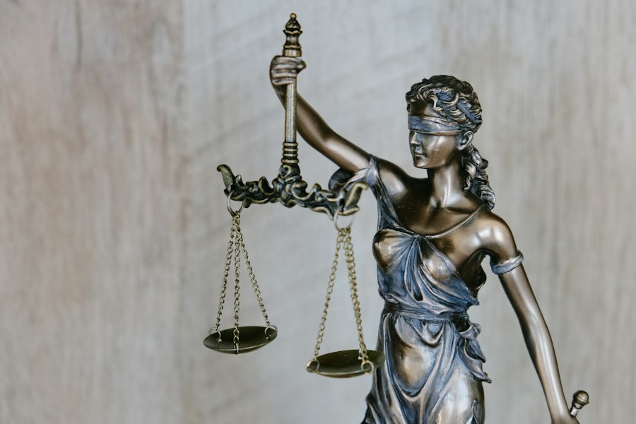 Scales of justice statue on a lawyer's desk